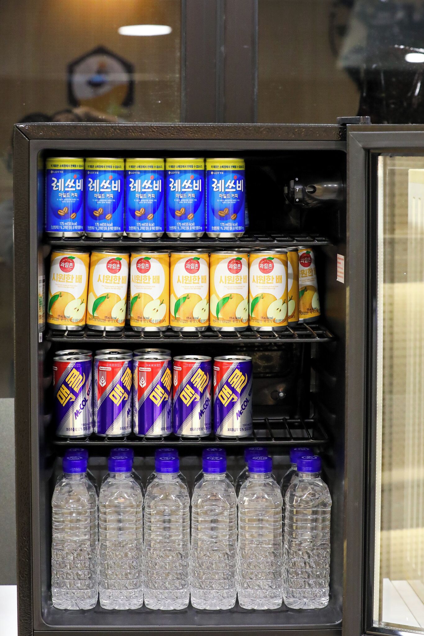 A vending machine stocked with beverages and snacks.