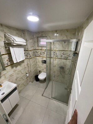 Shower, towels, soap, shampoo