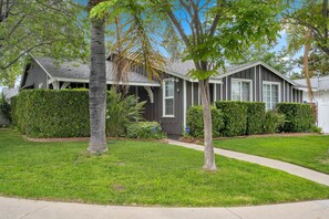 Stunning home with a beautifully landscaped yard and a single-story gabled roof.