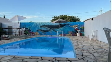 Outdoor pool, open 10:00 AM to 10:00 PM, pool umbrellas, sun loungers