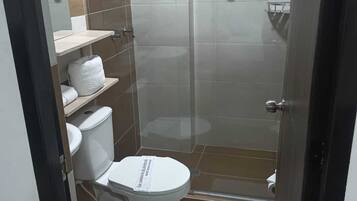 Standard Single Room | Bathroom | Shower, towels, soap, shampoo