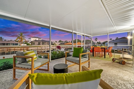 Outdoor dining. Waterfront Villa with Pool, Dock, Hot Tub & Gulf Access