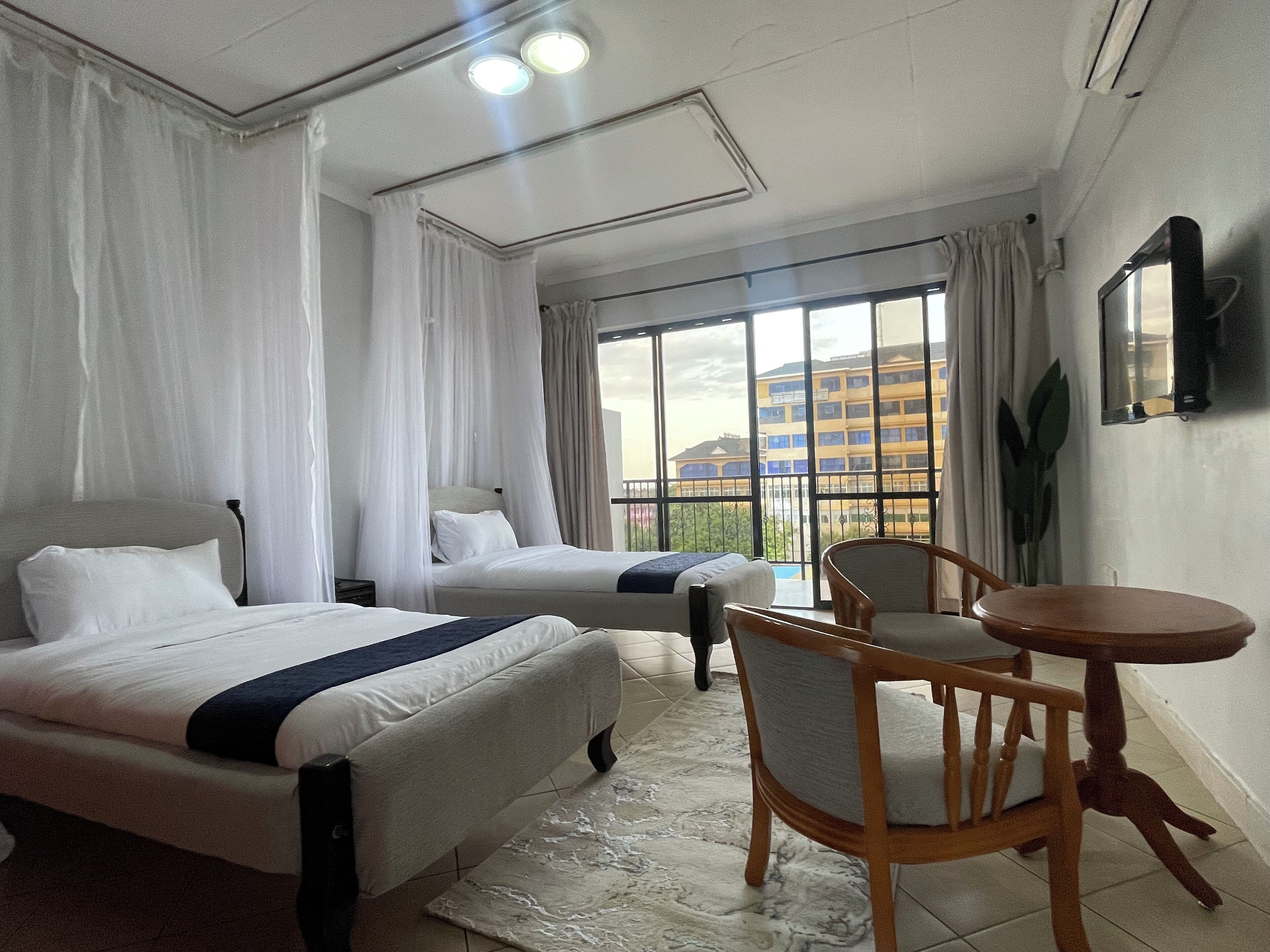 Deluxe Twin Room, Balcony, City View | In-room safe, iron/ironing board, free WiFi