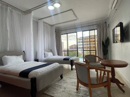 Deluxe Twin Room, Balcony, City View | In-room safe, iron/ironing board, free WiFi