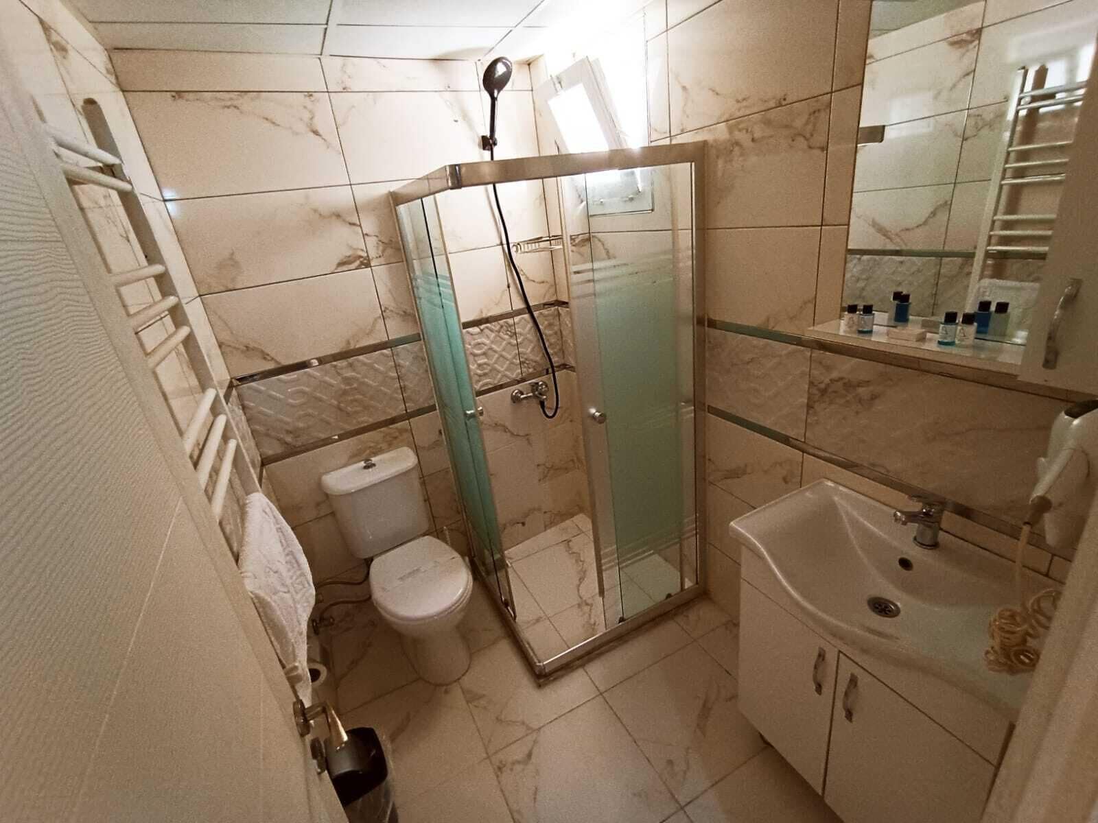 Hair dryer, slippers, towels, soap