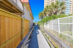 Stroll along the boardwalk, offering scenic views of the surrounding buildings.