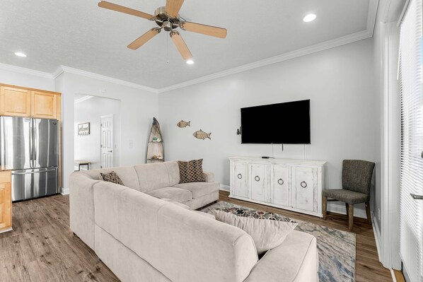 Curl up on the queen sleeper sofa & stream your favorites on the smart TV