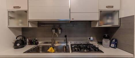 Apartment, Balcony | Private kitchen | Full-size fridge, oven, stovetop, coffee/tea maker