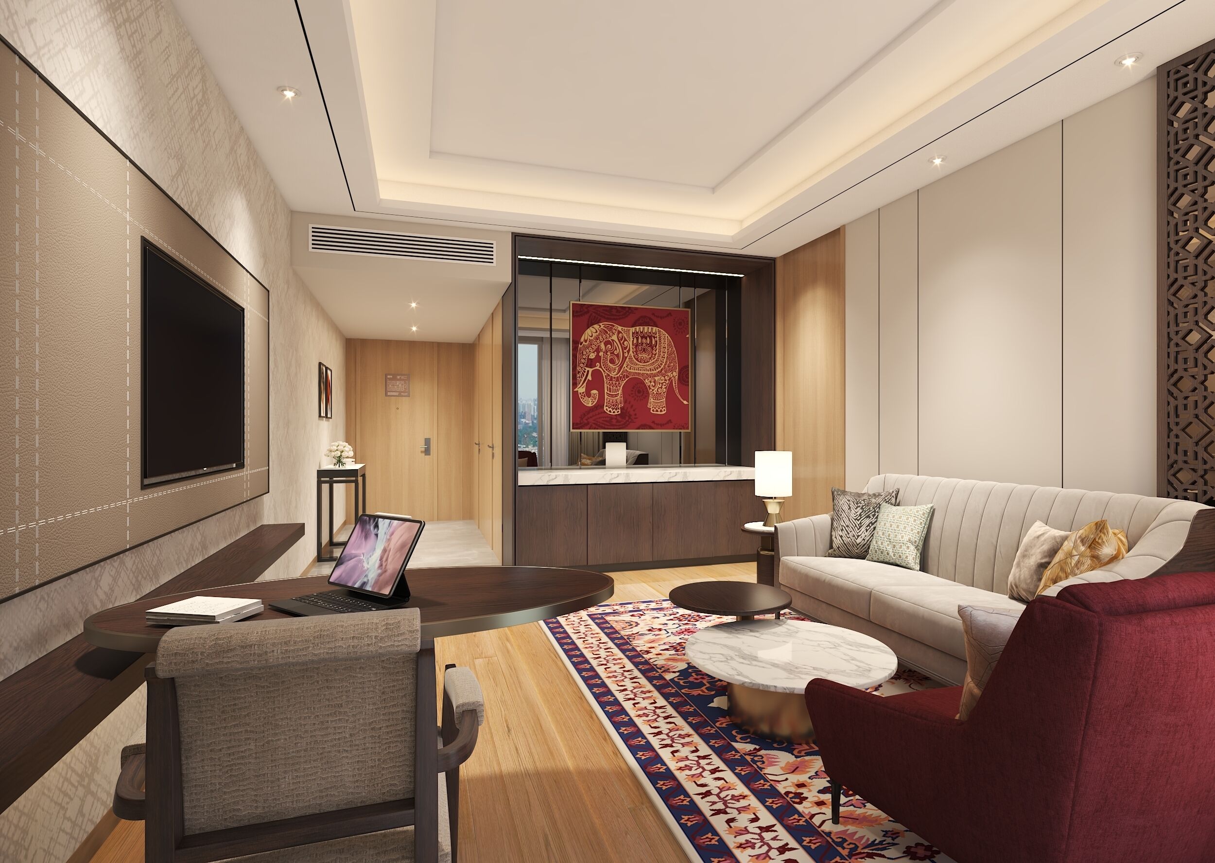 Una habitación de hotel moderna con sofá, sillón, mesa de centro y televisor.