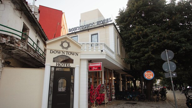 A hotel with a sign reading "Downtown Hotel" and a "Souvenir Shop" sign. - DownTown Hotel (Shkodër)