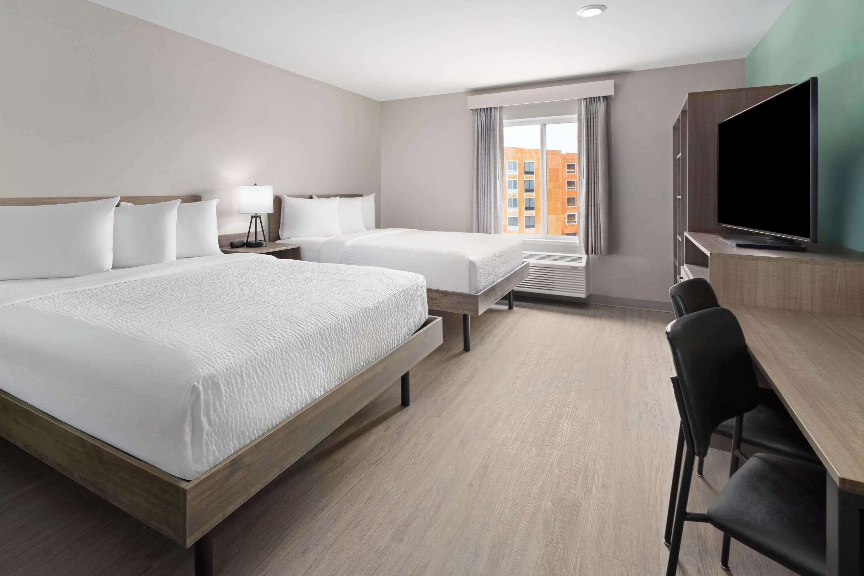 Suite, 2 Queen Beds, Non Smoking | Desk, laptop workspace, free WiFi, bed sheets