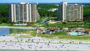 A resort with high-rise buildings, a beach, and a pool area. -  Discount option!! Beautiful views! 3BR/3BA Oceanfront condo Ocean Creek Resort! (Myrtle Beach)