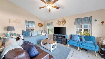 Téléviseur, table de baby-foot, table de ping-pong