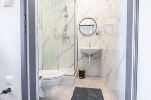 Shower, hair dryer, towels, soap