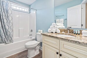 Shower, hair dryer, towels, toilet paper