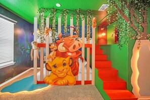 A children's play area with a slide, a climbing wall, and a staircase. - You and Your Family will Love this Luxury Villa on Windsor Cay Resort (Orlando)