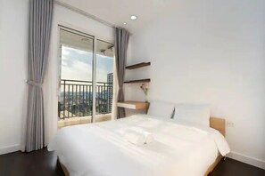 Deluxe Apartment, 3 Bedrooms, City View | Desk, laptop workspace, blackout drapes, free WiFi