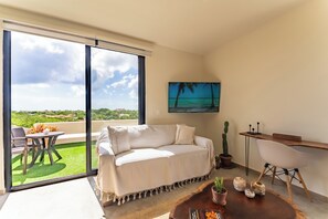 Junior Studio, 1 King Bed with Sofa bed, Refrigerator, Golf View | Living area | 55-inch LCD TV with digital channels, Netflix, streaming services