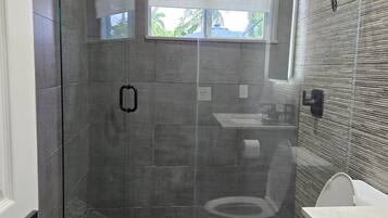 Shower, hair dryer, towels, soap