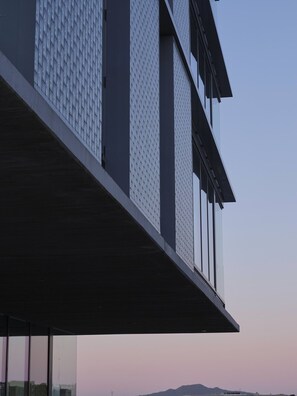 A modern building with a flat roof and large windows.