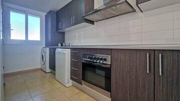 Fridge, stovetop, dishwasher, coffee/tea maker