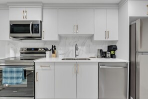 Fridge, microwave, oven, stovetop - Spacious 2-Bedroom Legal Basement Suite | Private Entrance | 15 Mins to Airport (Calgary)