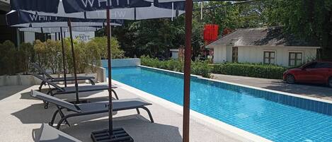 Outdoor pool, open 7:00 AM to 7:30 PM, pool umbrellas, pool loungers