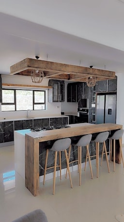 Private kitchen. Brand New 3-bedroom house in Tubungu Estate with WiFi, AC. Enjoy your stay