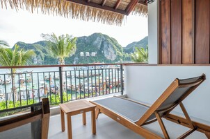Habitación Deluxe, vistas al mar | Minibar, wifi gratis, ropa de cama