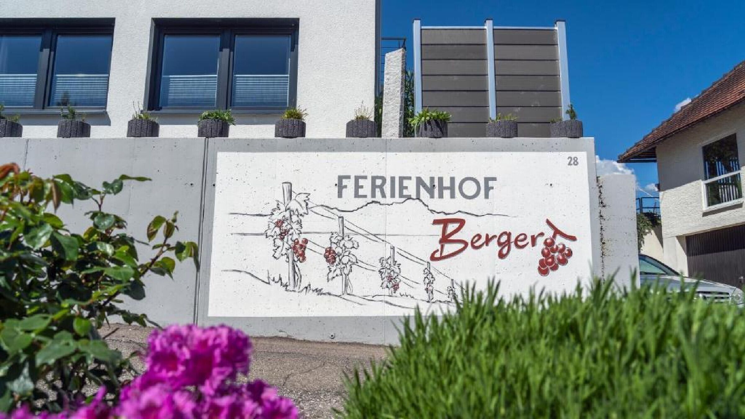 A building with a sign that reads 'FERIENHOF' and 'Bergers'.