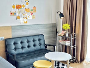 Deluxe Studio, Balcony, City View | Living area | Flat-screen TV, Netflix, streaming services