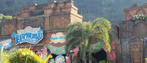 A theme park entrance with a sign for 'Lost World of Tambun' and 'RR-FACT'.