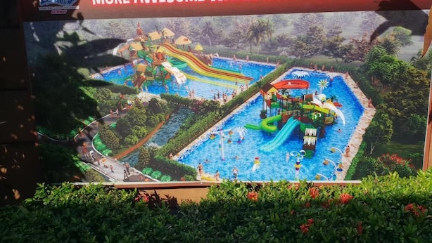 A water park with a sign announcing new water rides. - Tambun D'Mewah homestay (Ipoh)