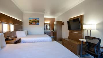 Desk, iron/ironing board, bed sheets