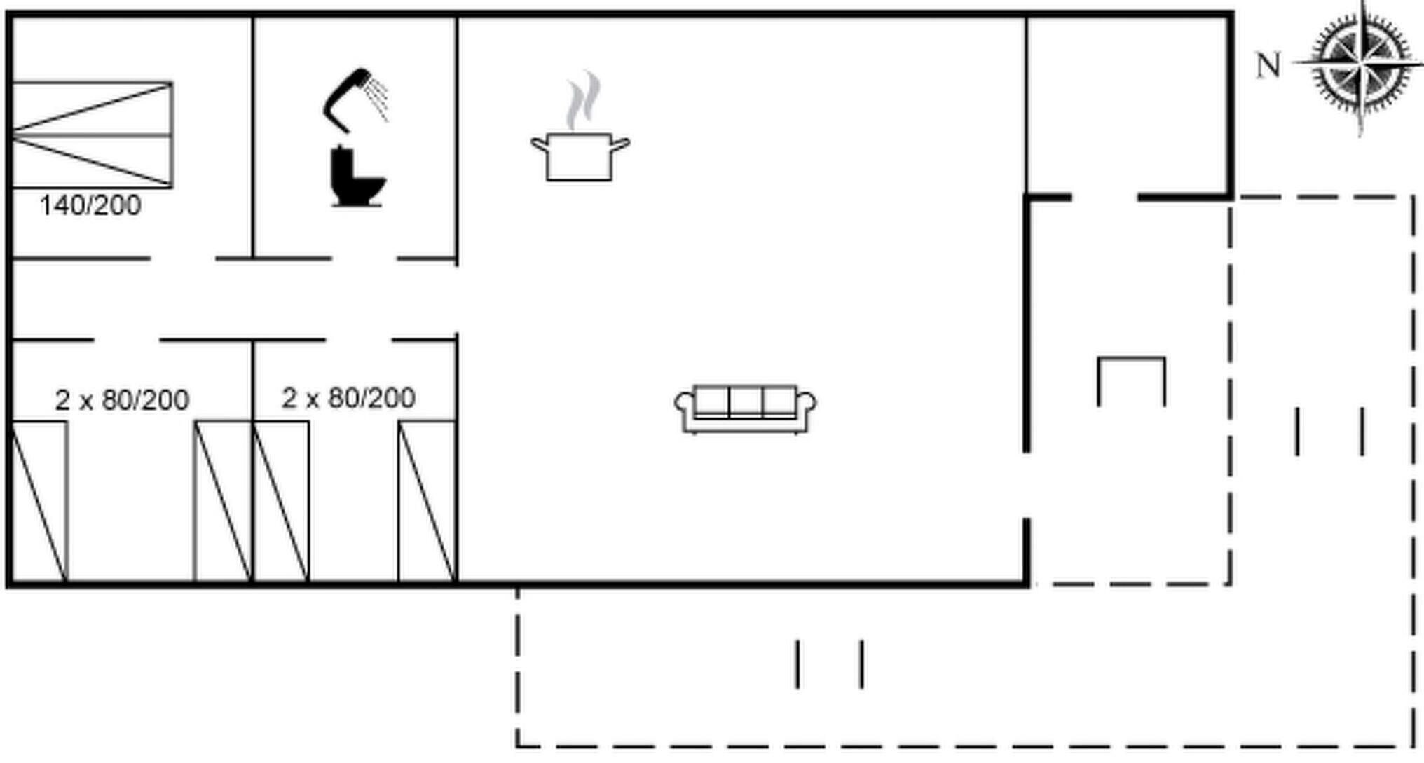 Un plan d’étage comprenant une cuisine, deux toilettes, un canapé et une boussole indiquant le nord.