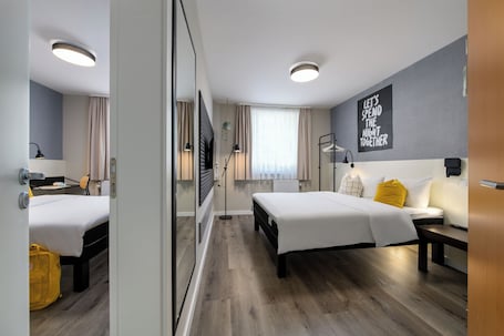 Family Room, Non Smoking, City View | Soundproofing, free WiFi, bed sheets