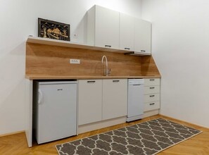 Studio (Standard Studio Apartment) | Private kitchen | Fridge