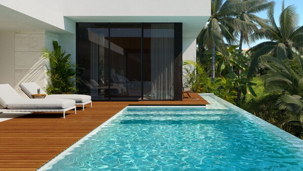 Un espace moderne aménagé au bord de la piscine, avec une piscine à eau claire, une terrasse en bois et des chaises longues.