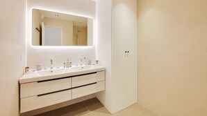 A modern bathroom with a large mirror, two sinks, and a wardrobe. - Charming Apt With AC & Balcony (Suresnes)