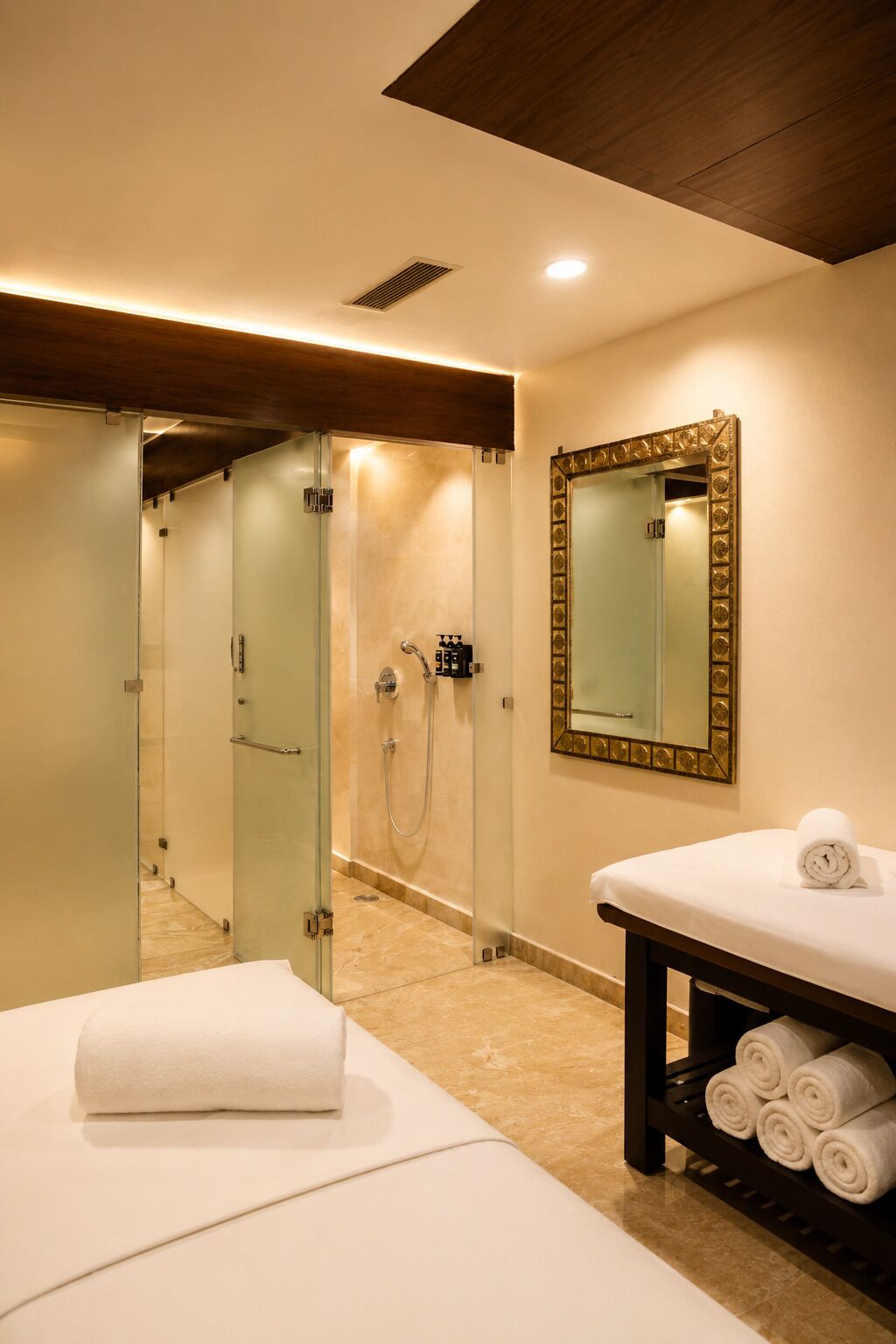 A modern bathroom with a glass shower enclosure, a vanity with a mirror, and a towel rack.