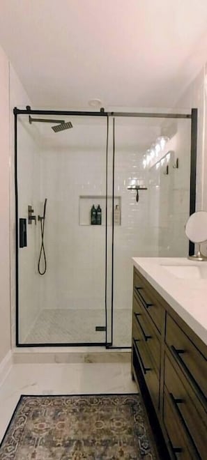 Shower, eco-friendly toiletries, hair dryer, towels