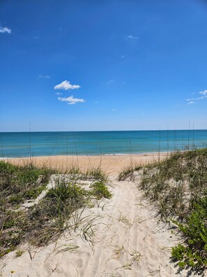 On the beach, sun loungers, beach towels