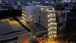 A multi-story hotel with balconies and a rooftop area. - Dragon View Riverfront Hotel  (Da Nang)