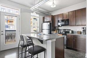 Fridge, microwave, oven, stovetop - Downtown Indy | 3 Units, Sleeps 18 + Parking (Indianapolis)