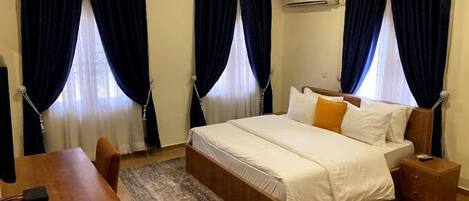 Deluxe Room, Balcony, City View | Desk, laptop workspace, free WiFi