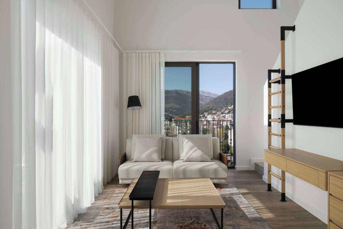 Family Apartment, 3 Bedrooms, Bay View (SIRO) | Living area | 55-inch Smart TV with cable channels
