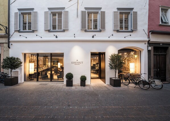 A boutique hotel with a modern interior, large windows, and a welcoming entrance. - Eisenhut Boutique Hotel  (Bolzano)