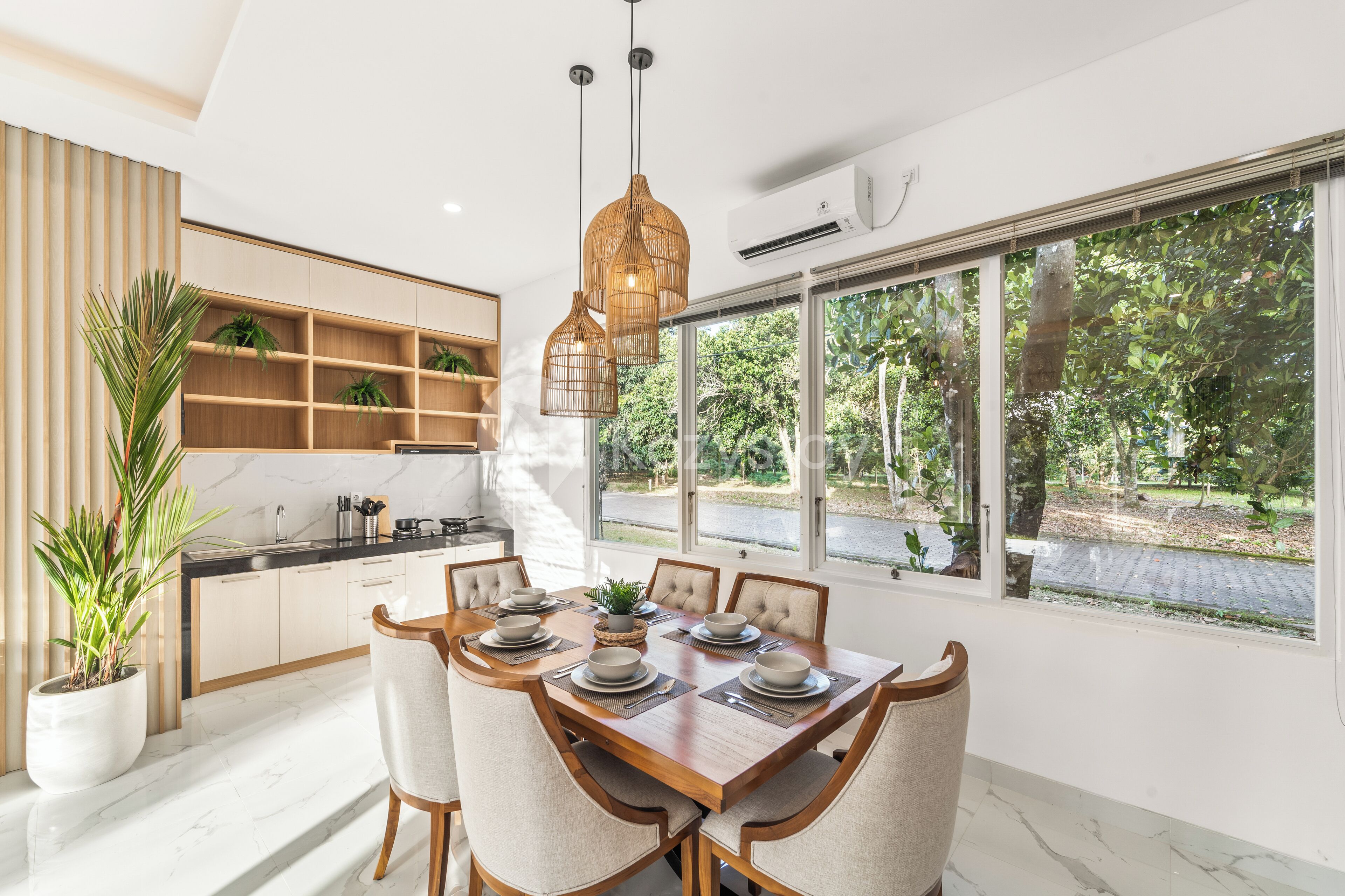 A modern kitchen with a dining area.
