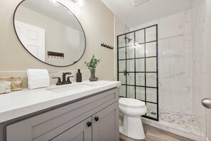 Shower, hair dryer, towels, shampoo