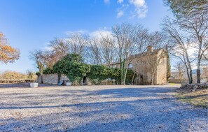 Surrounded by lush greenery, this historic building offers a serene escape.